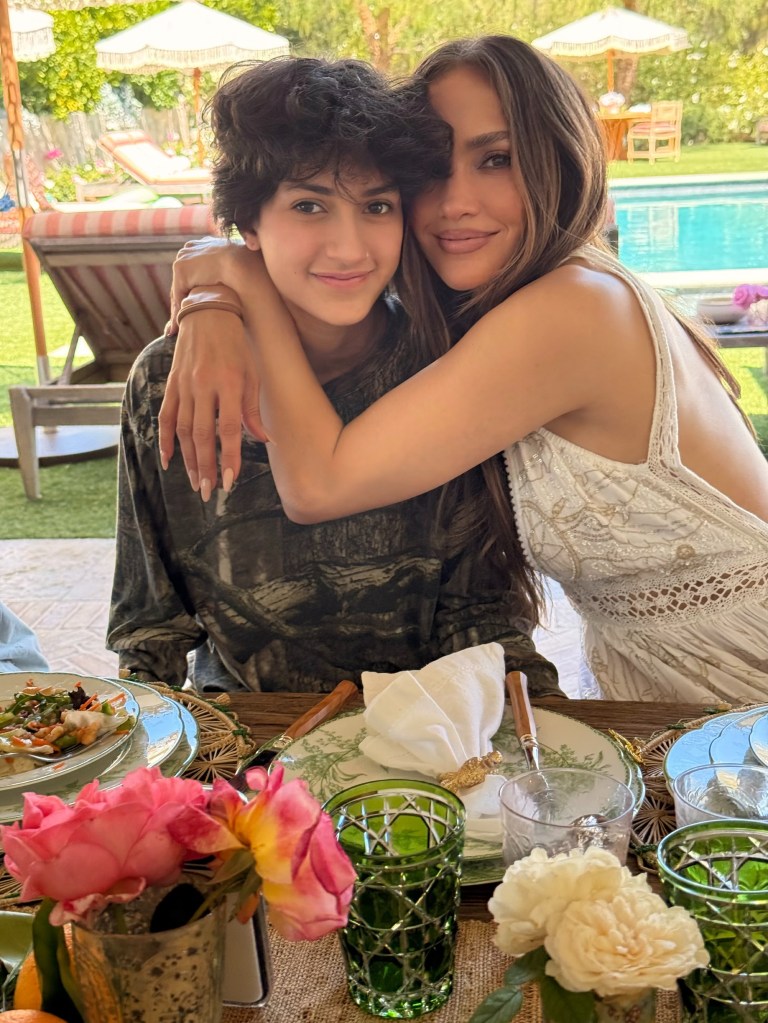 Jennifer Lopez embraces her child, Emme.