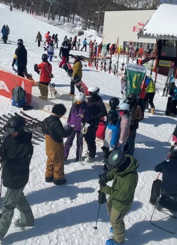 People skiing and snowboarding at Sapporo Teine Ski Resort.