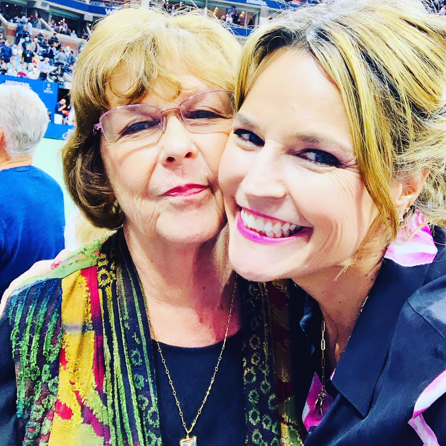 Nancy and her daughter smiling together.