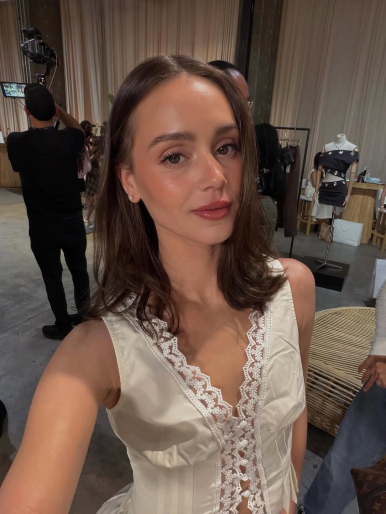 Mikayla Matthews in a white lace top.
