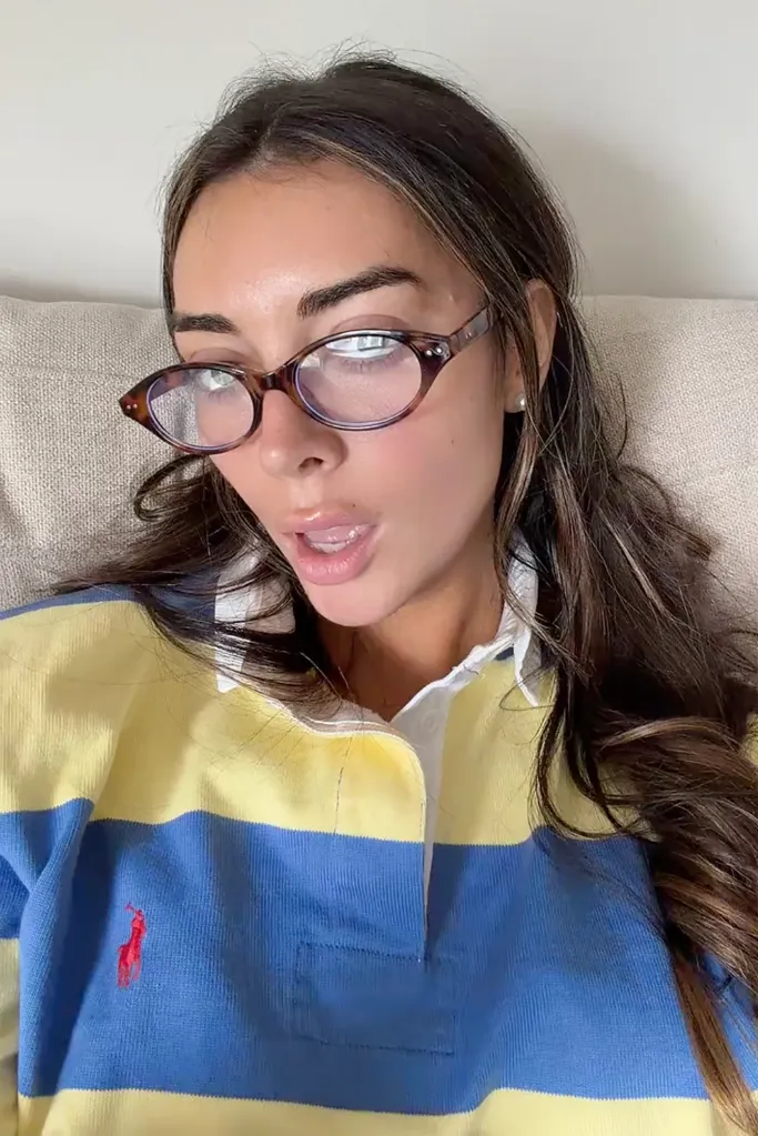 Brianna Chickenfry wearing glasses and a striped polo shirt.