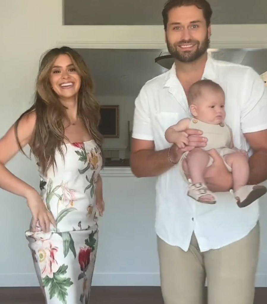Taylor Frankie Paul and Dakota Mortensen holding a baby.