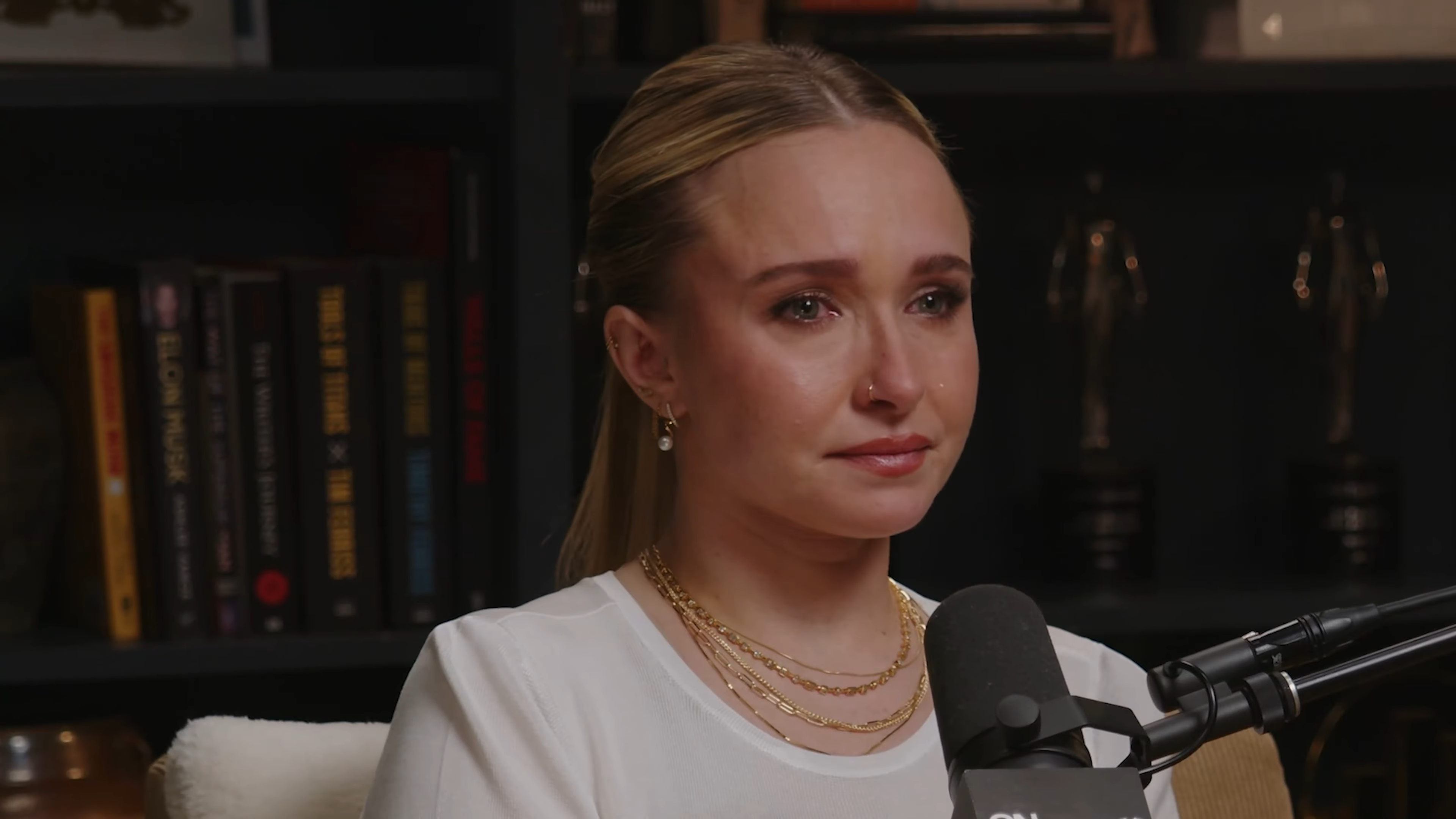 Hayden Panettiere looking tearful during an interview.