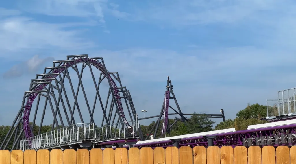 Six Flags Project Purple rollercoaster under a blue sky.