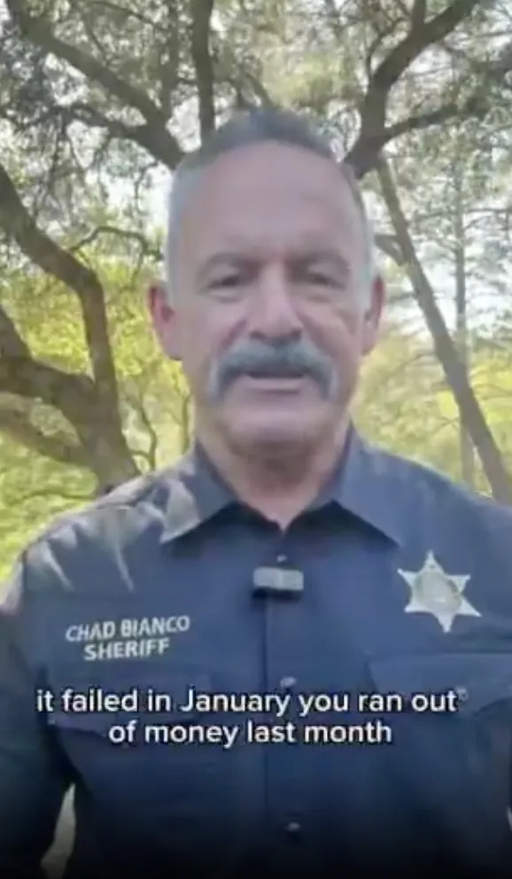 Sheriff Chad Bianco speaking outdoors with text overlay.