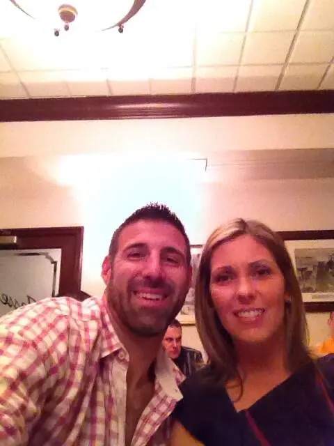 Mike Vrabel and wife Jen Vrabel smiling.