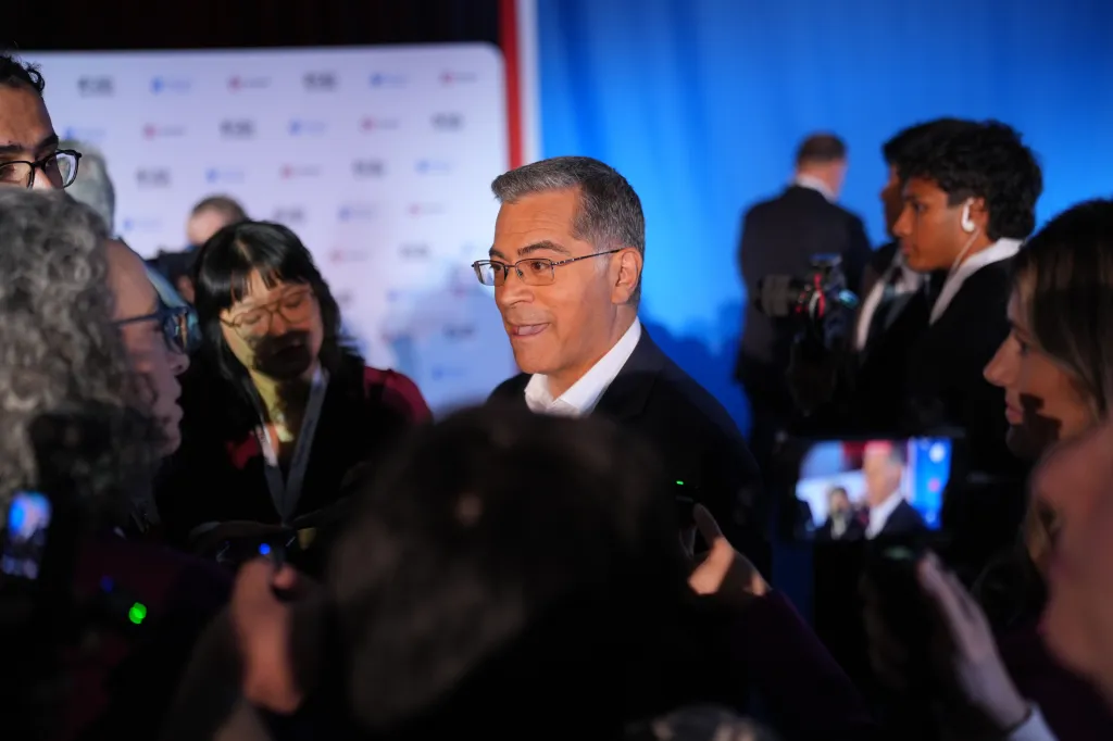 Xavier Becerra speaks with members of the media following a California gubernatorial debate.
