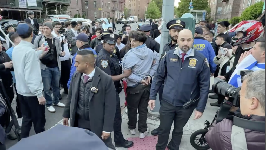 At least three people were detained after agitators swarmed the area near the Young Israel Senior Services of Midwood, which was hosting an event promoting real estate in Israel and the West Bank.