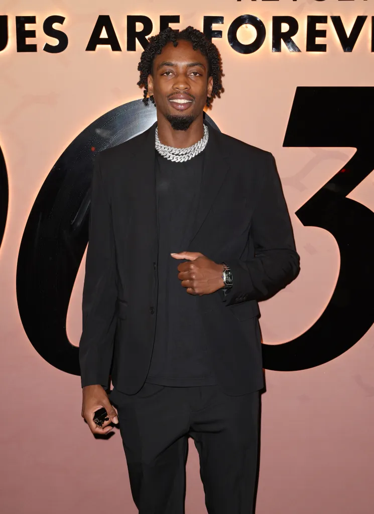 Zaire Wade posing at Dwyane Wade's 003 Statues Are Forever Party With FWRD