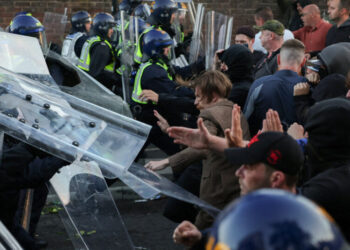 U.K. Protests Over Murder Case Turn Violent, as Leaders Urge Calm