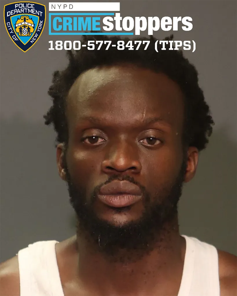 Mugshot of a Black man with short, dark, curly hair and a beard, wearing a white tank top, with NYPD Crime Stoppers information.