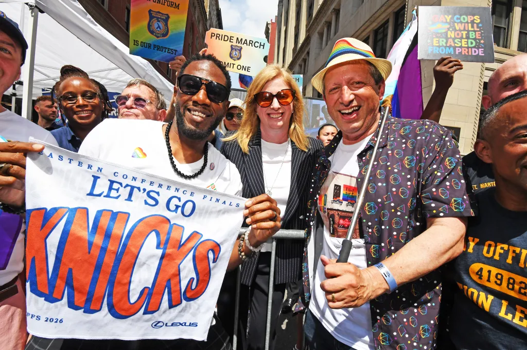Jumaane Williams, Police Commissioner Jessica Tisch, and Brad Lander at the NYC Gay Pride Parade, with Williams and Tisch holding a 