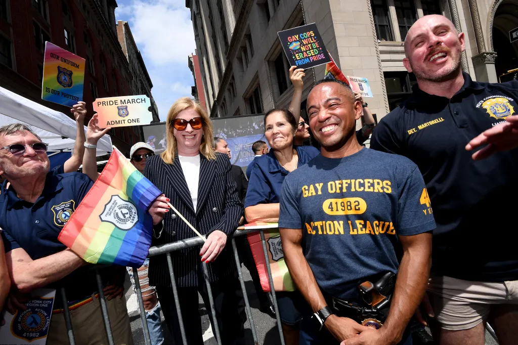 Police Commissioner Jessica Tisch with gay NYPD officers at the NYC Gay Pride Parade.