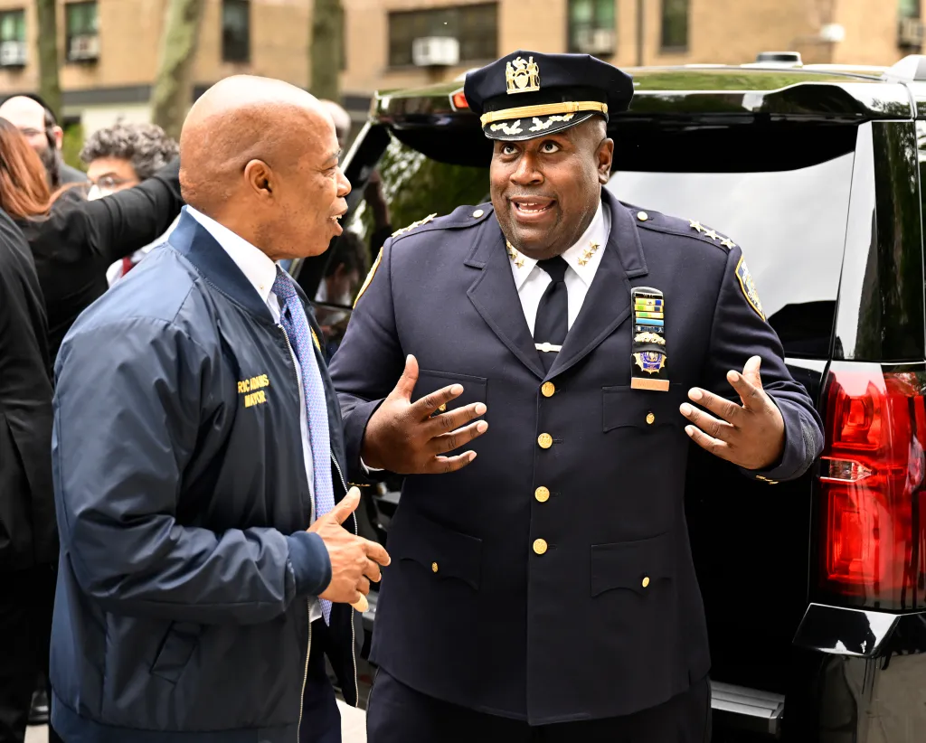 NYC Mayor Eric Adams talks with NYPD Housing Chief Jeffrey Maddrey.