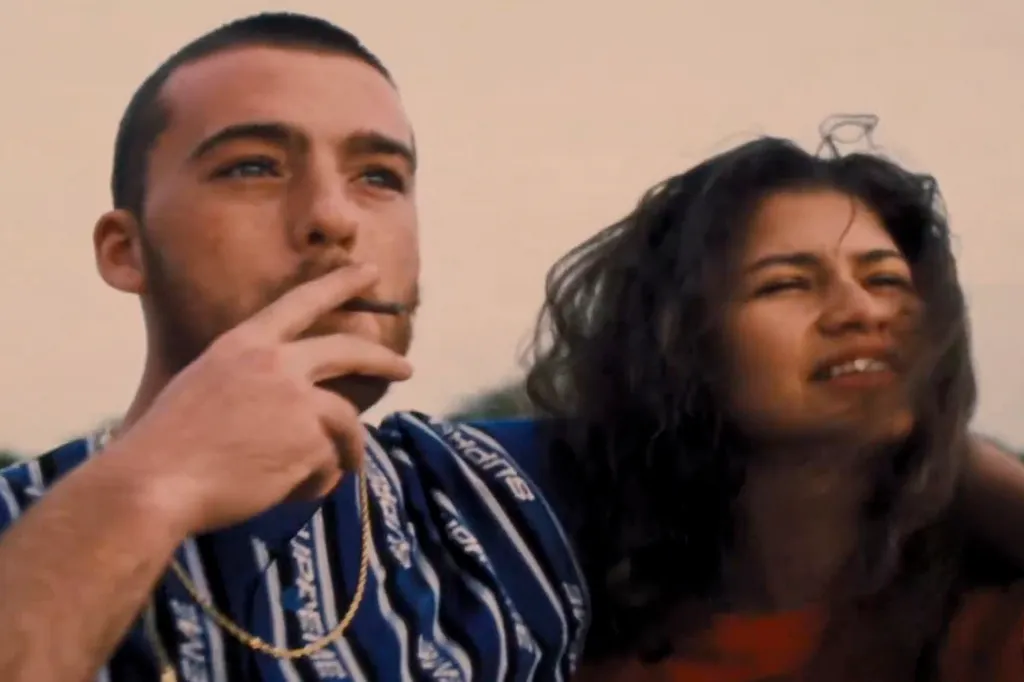 Actor Angus Cloud (Fezo) smoking with actress Zendaya (Rue) in