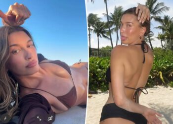 Hailey Bieber shows off toned abs in behind-the-scenes photos from new Rhode beach campaign