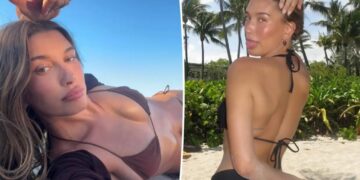 Hailey Bieber shows off toned abs in behind-the-scenes photos from new Rhode beach campaign