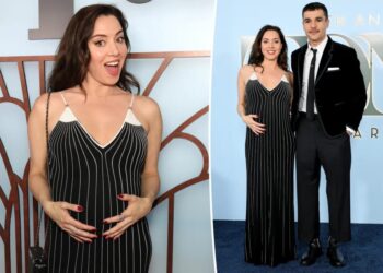 Aubrey Plaza cradles her baby bump while supporting partner Chris Abbott at Tony Awards 2026