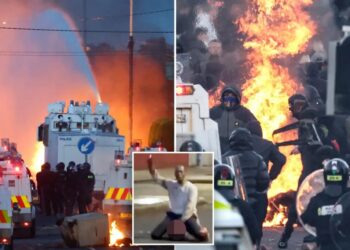 Police blast water cannons at Belfast protesters as unrest flares again after stabbing
