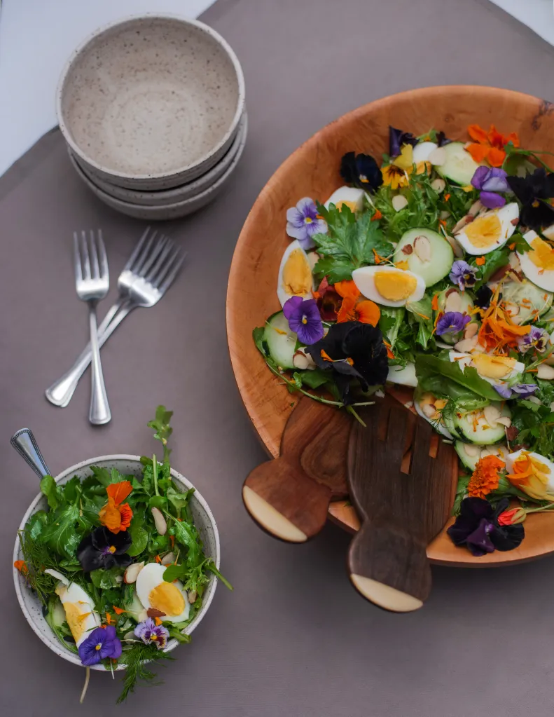 A salad in a brown bowl