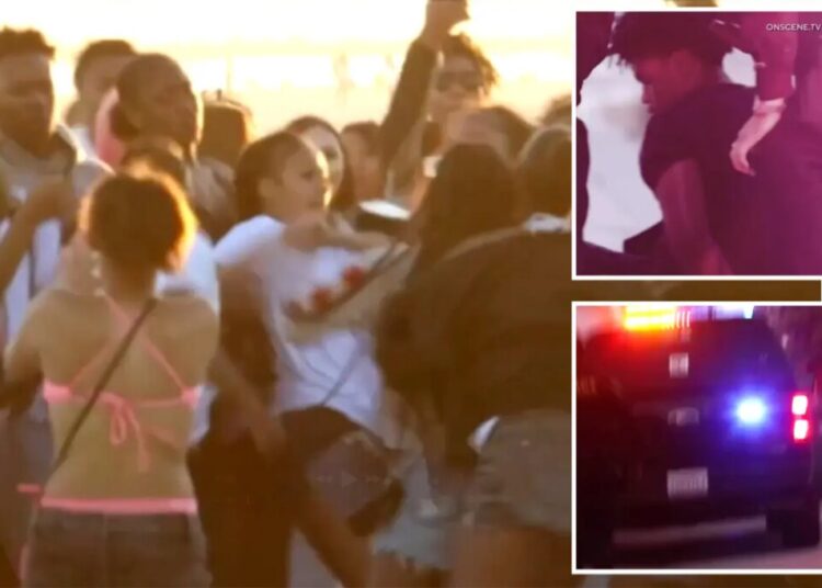 Wild brawl breaks out as hundreds of teens descend on SoCal beach