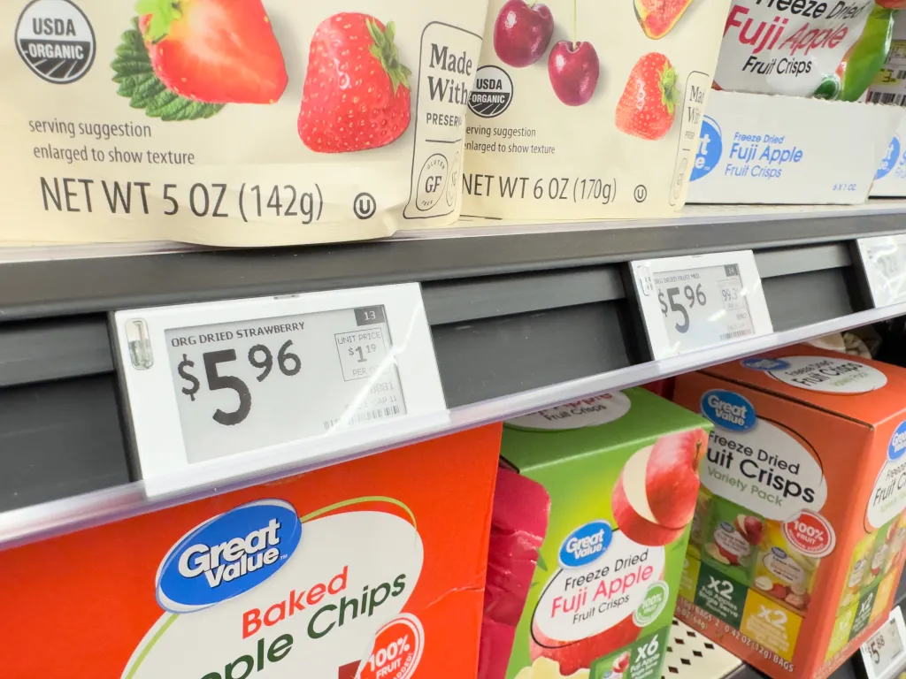 A digital shelf tag on a grocery store shelf.