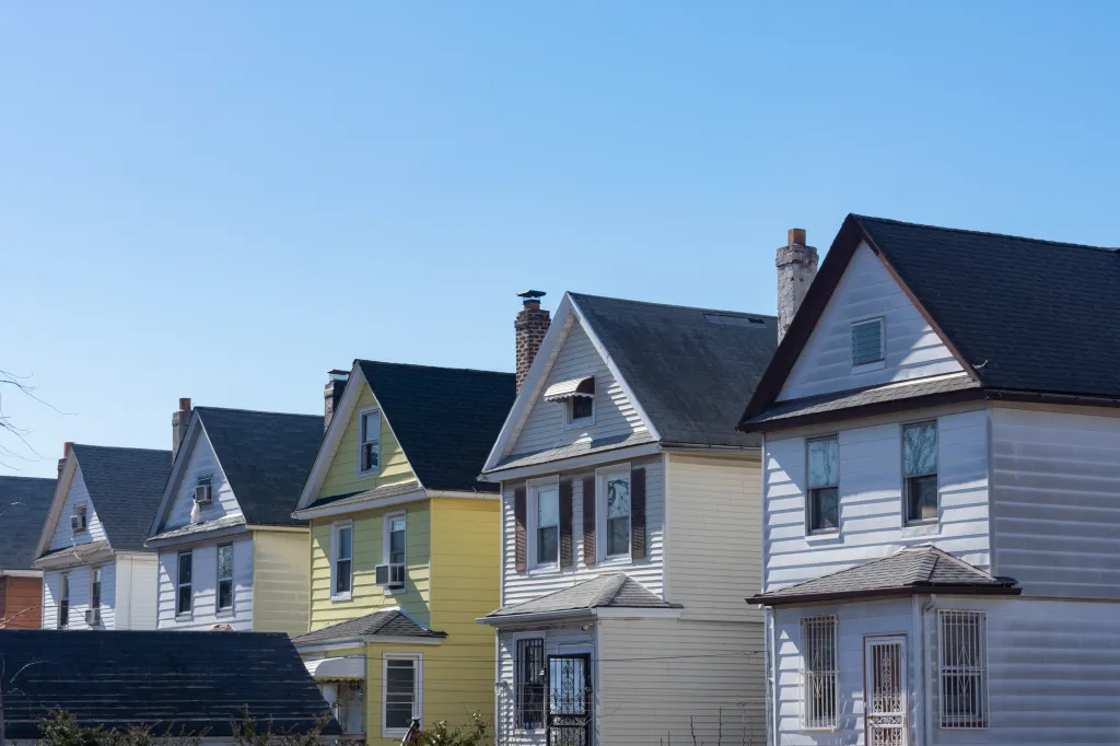 A row of old wooden homes in Elmhurst, Queens.