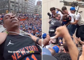 Chaotic moment Knicks fans climb structure to save reveler from apparent overdose during championship parade