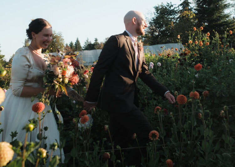 A Wedding Surrounded by Rows of Blooms