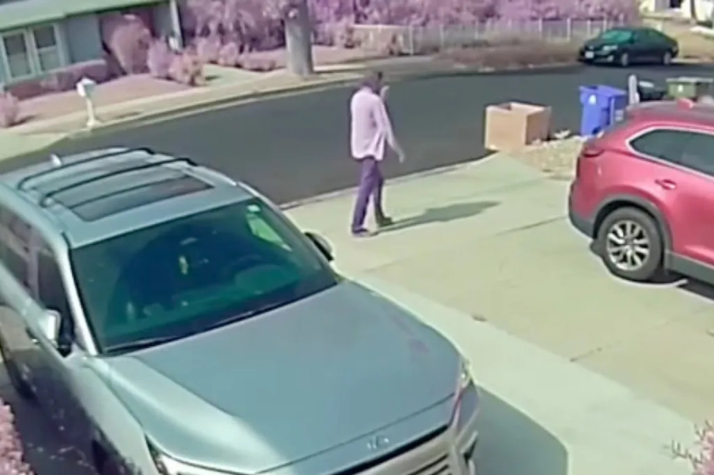 Surveillance footage of Michael Gledhill, the suspect in the murder of actor James Handy, walking away from a house.