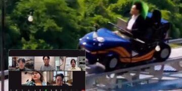 Man Attends Video Meeting From Active Roller Coaster