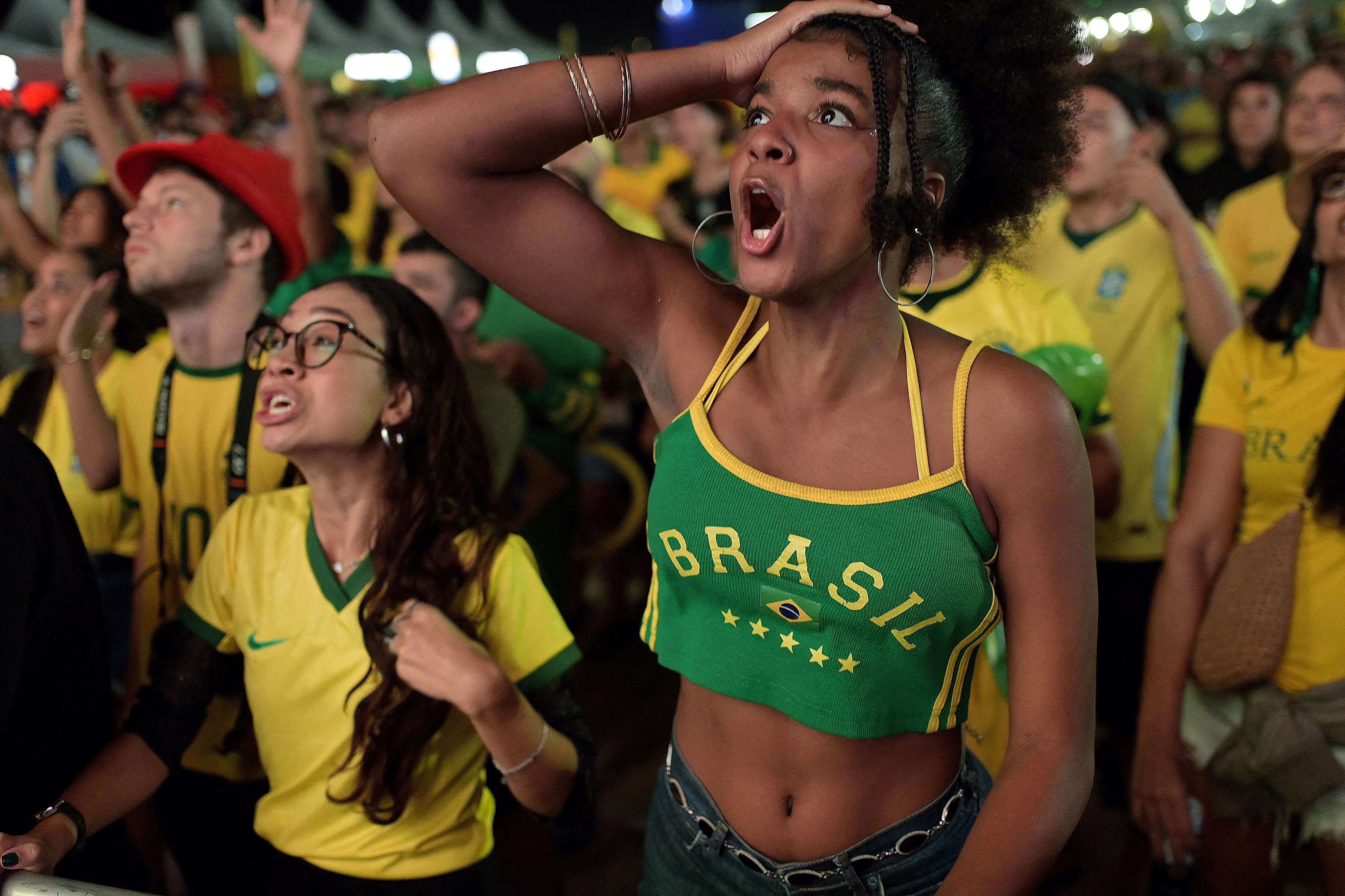 Team Brazil fans react during a watch party.