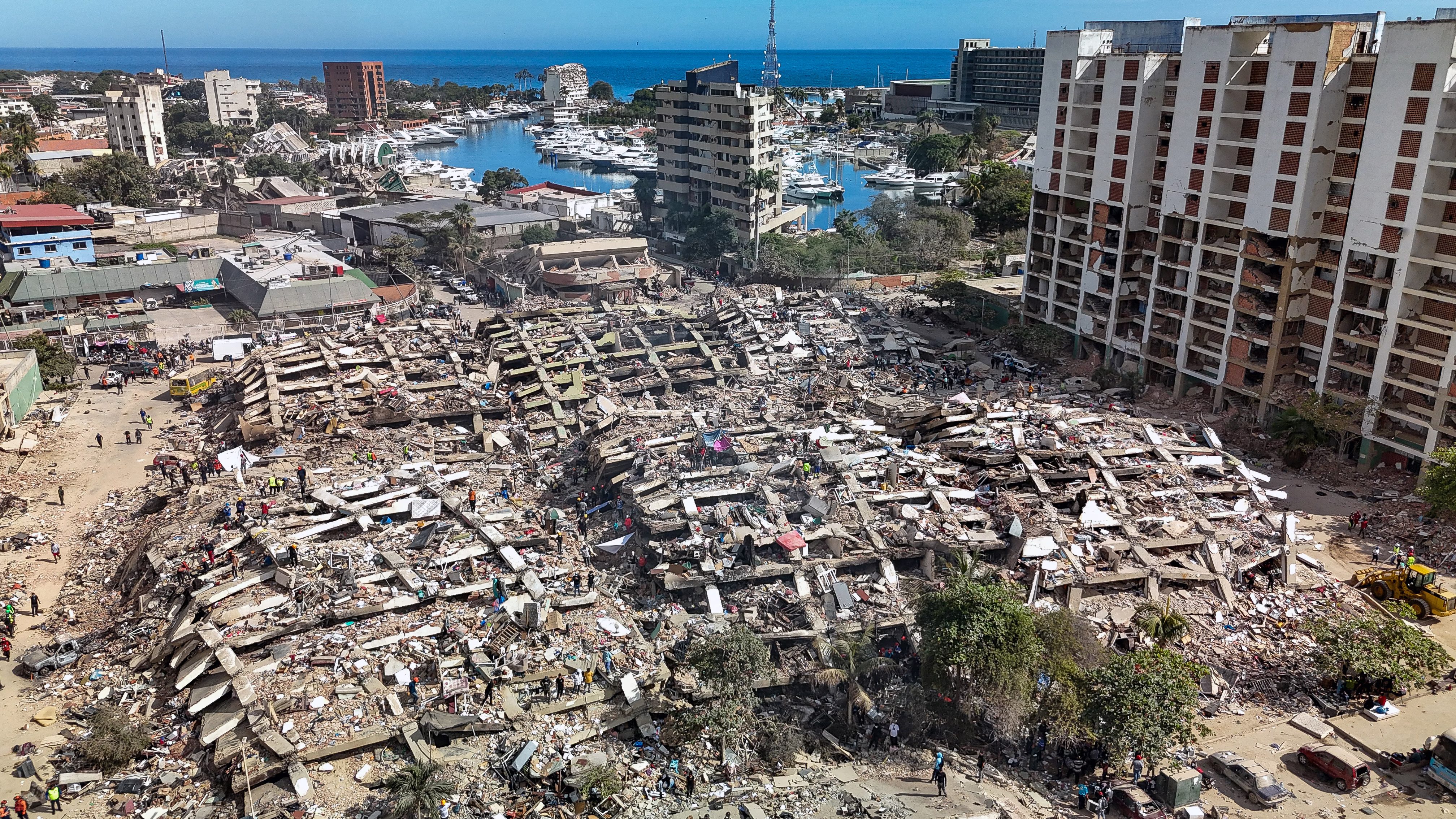 An aerial view of several collapsed buildings following an earthquake.