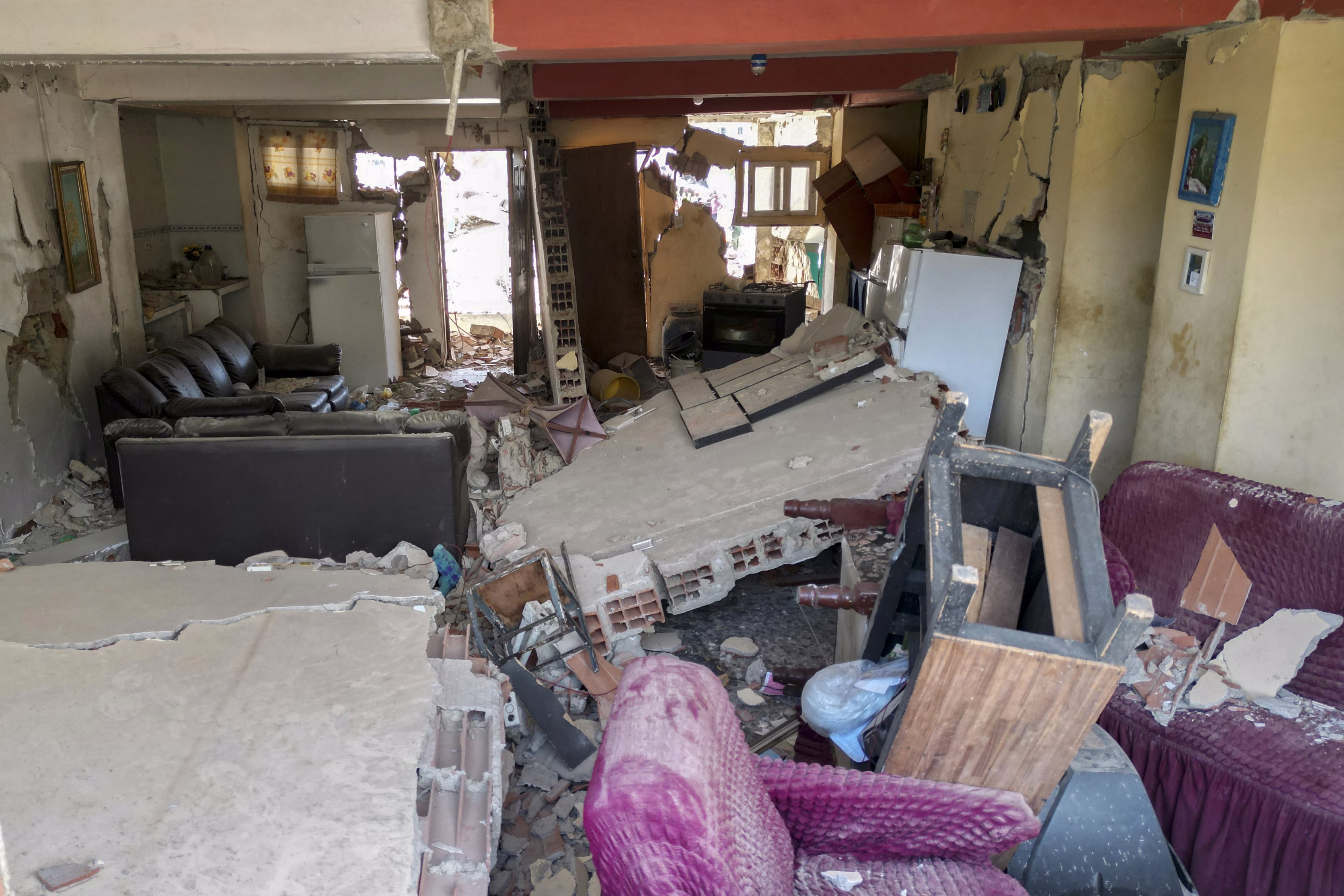 A view of the interior of an apartment in a partially-collapsed building