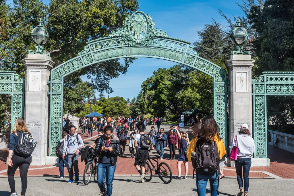 Students walking through Sather Gate at the University of Berkeley.