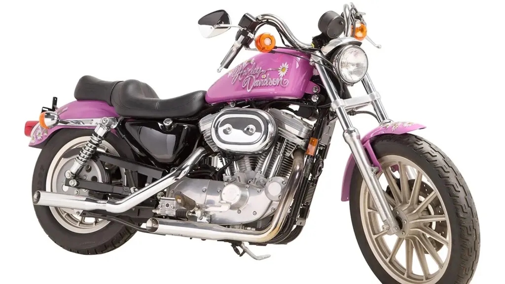 Ann-Margret's 1997 Harley-Davidson Sportster XL883 Hugger motorcycle in pink with daisy decals.