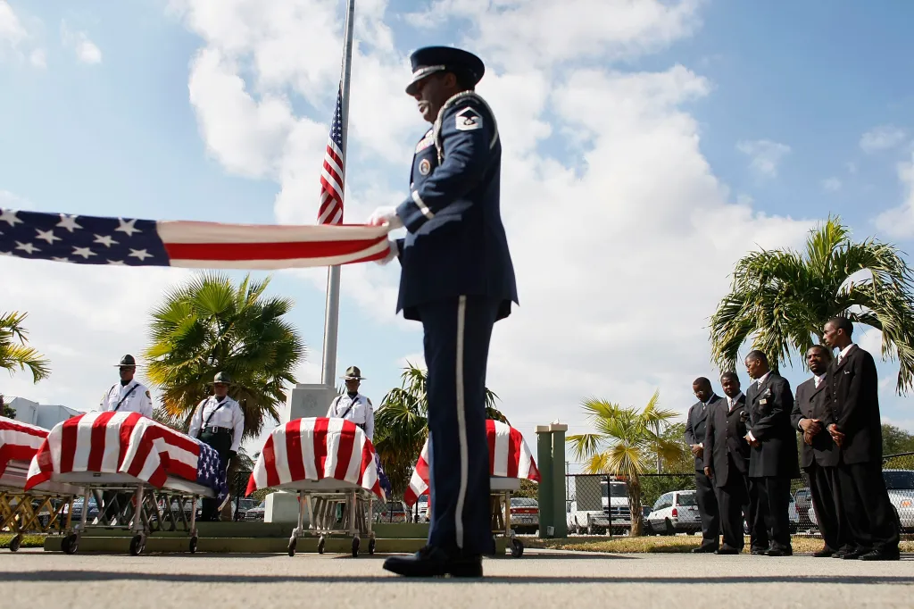 The Homestead Air Reserve base honor Guard folds an American flag during a funeral service in Miami, Florida, on Jan. 24, 2009.
