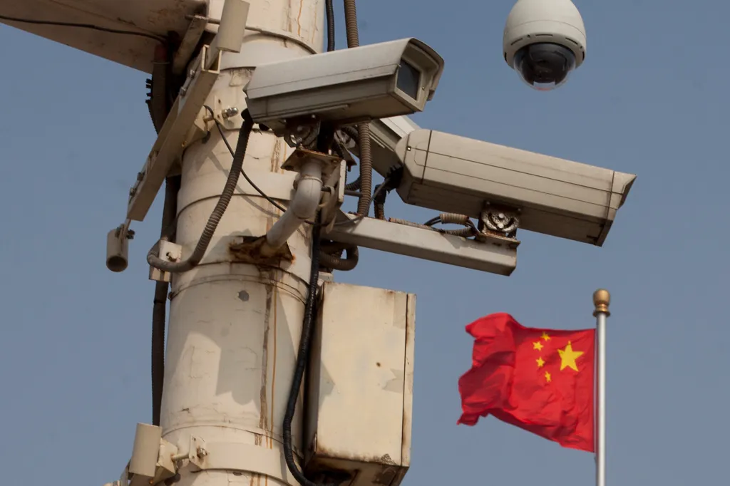 The Chinese national flag flies behind security cameras on Tiananmen Square on June 4, 2012 on the 23rd anniversary of China's crackdown of democracy protests in Beijing.