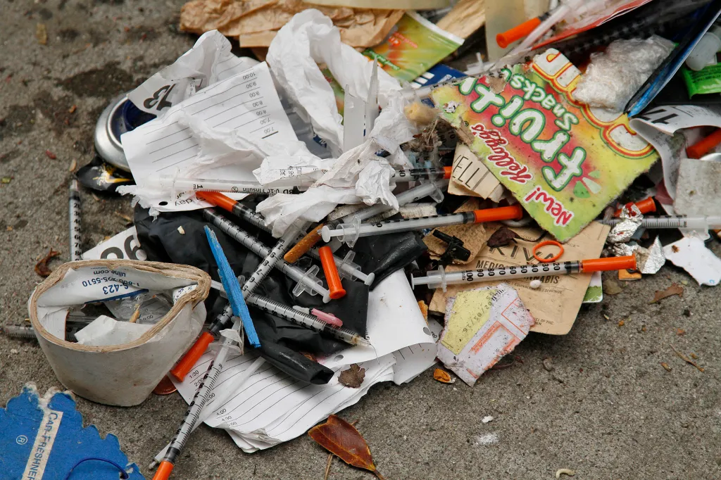 Syringes and trash littering a street in San Francisco.
