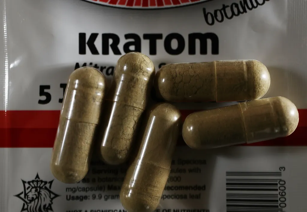 Kratom powder in capsules.