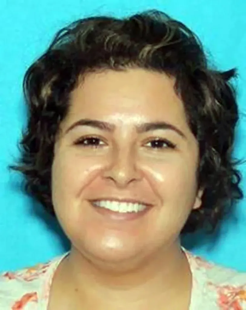 Vanessa O'Rourke, a woman with dark curly hair, smiling.