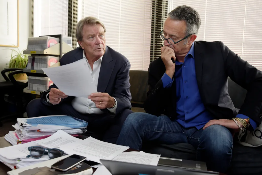 Steve Kroft and Michael Gavshon reviewing a script in the 
