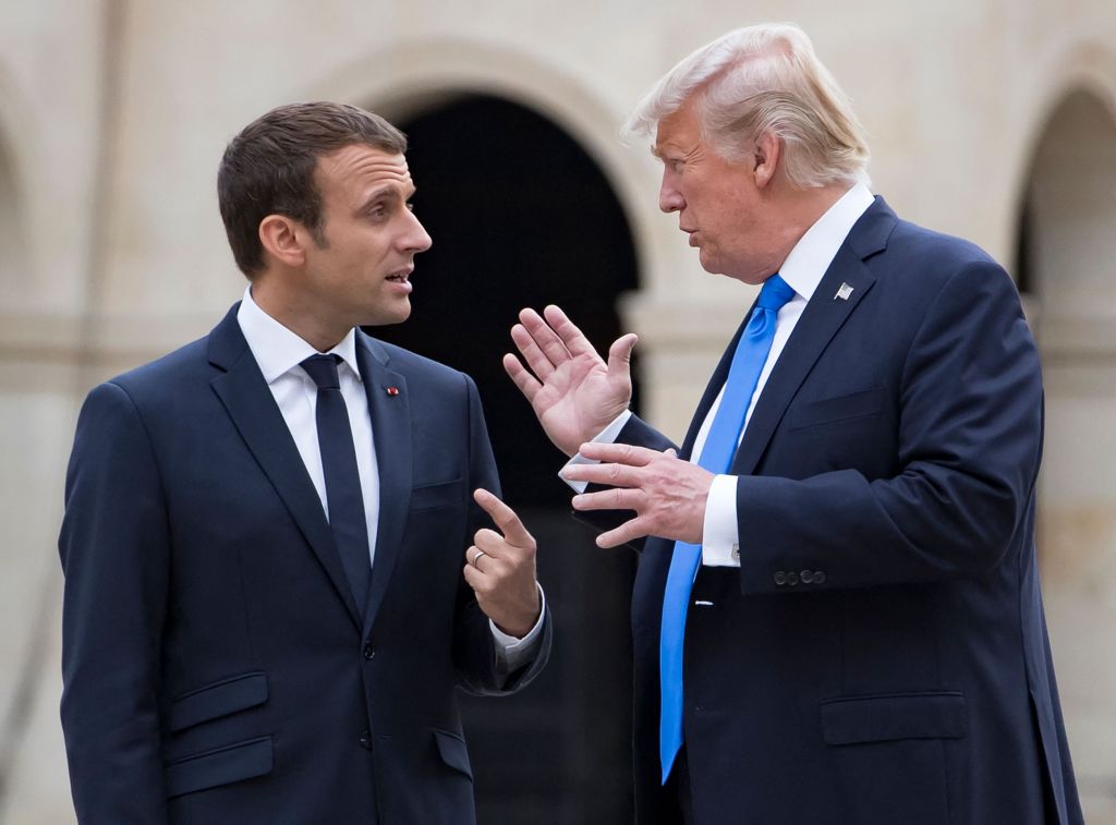 French President Emmanuel Macron and US President Donald Trump talking and gesturing.