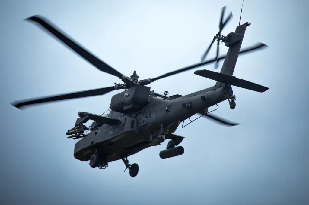 An AH-64 Apache helicopter in flight.