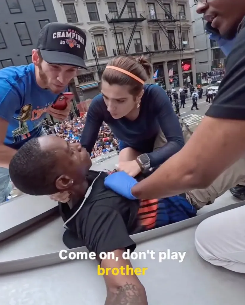 Simone Kelly speaks to the unidentified man after administering Narcan.