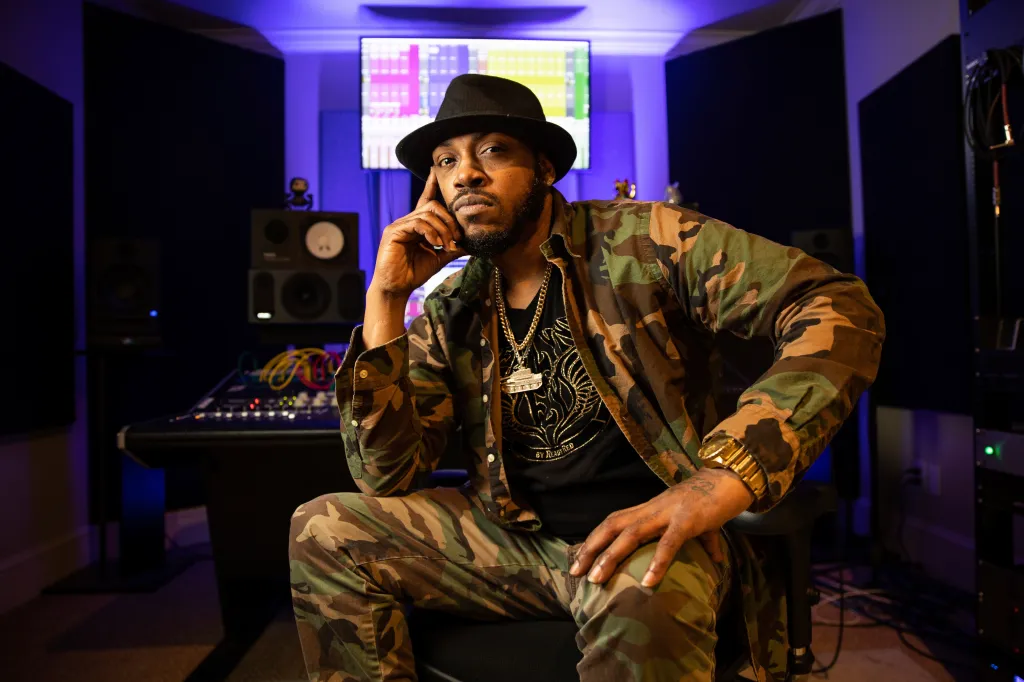 Rapper Mystikal poses for a portrait in a recording studio.