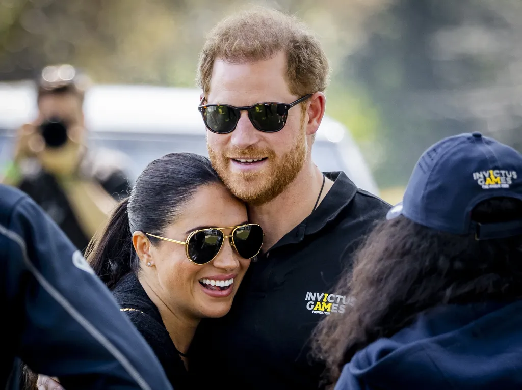 Prince Harry and Meghan Markle embrace at The Invictus Games.