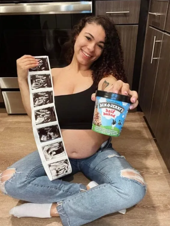 Jade Benning posing on the ground with Ben & Jerry's Half Baked ice cream and ultrasound photos.