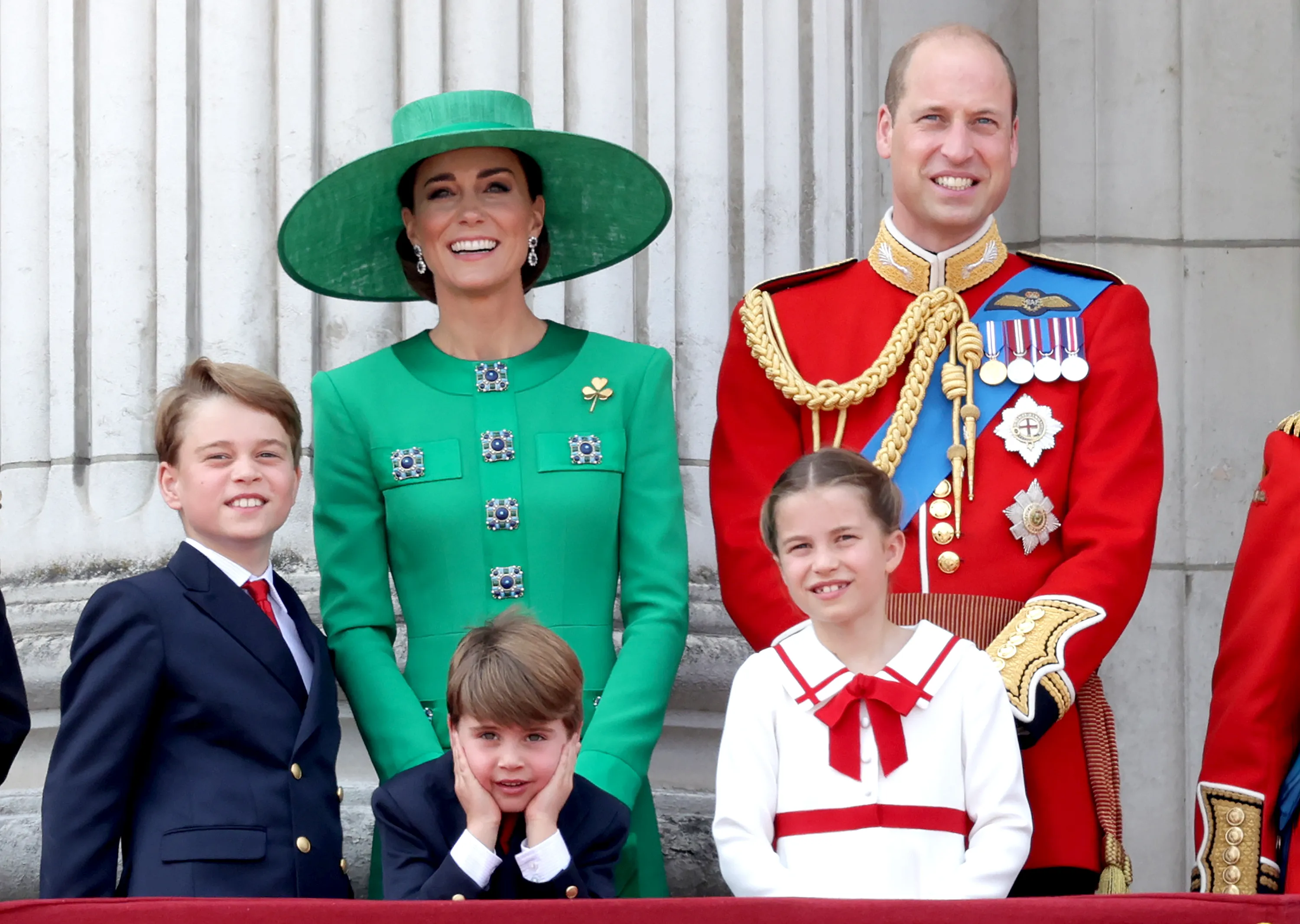 Prince William, Prince of Wales, and Catherine, Princess of Wales, with their children, Prince George, Prince Louis, and Princess Charlotte on the Buckingham Palace balcony during Trooping the Colour.