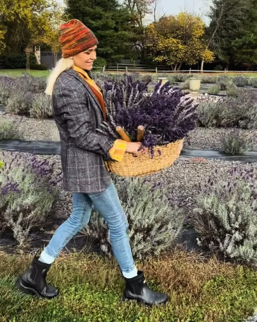 Yolanda Hadid in a lavender field, carrying a basket of lavender.